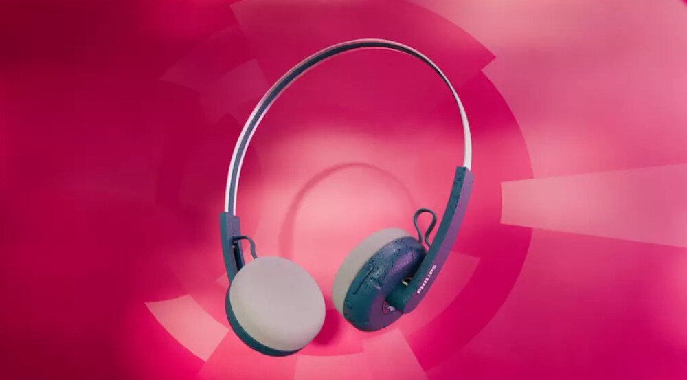 Słuchawki PHILIPS TAH2000TL/00 lekki pałąk i dodatkowe poduszki nauszne, słuchawki po skosie na różowym tle