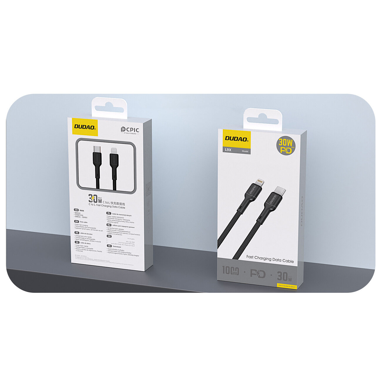 Na obrazie znajdują się dwa opakowania kabli marki DUDAO. Na jednym z nich widnieje napis \'30W PD Fast Charging Data Cable\'.