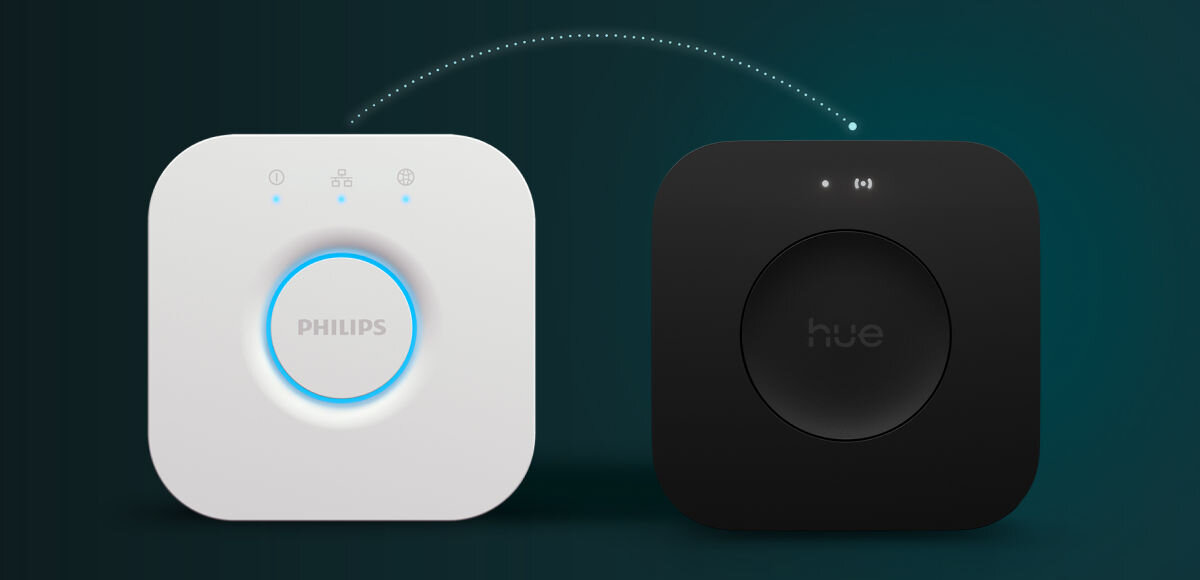 Zestaw startowy PHILIPS HUE 929003853503 8.1W E27 A60 (3 szt.) + Mostek + Regulator, Inteligentne, bezprzewodowej, miejsce, chip, na zielonym tle biały i czarny hue bridge frontem na wprost