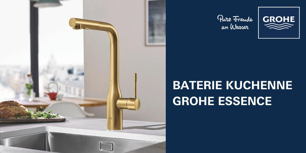 Złota bateria kuchenna GROHE Essence zamontowana na blacie kuchennym. Obok znajduje się napis \'BATERIE KUCHENNE GROHE ESSENCE\' oraz logo GROHE z tekstem \'Pure Freude an Wasser\'.