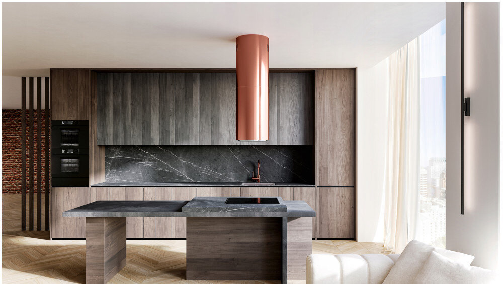 Okap GLOBALO Heweno Isola 39.2 Miedziany mat Zdjęcie przedstawia zbliżenie na dolną część cylindrycznego okapu kuchennego marki GLOBALO, z wyraźnie widocznym, okrągłym panelem LED odpowiadającym za równomierne, jasne oświetlenie powierzchni roboczej. Widoczny jest minimalistyczny design oraz dotykowy panel sterowania filtr aluminiowy pochłanianie tłuszczu okap filtr tłuszczowy tryb pochłaniacza filtry węglowe eliminacja zapachów oczyszczanie powietrza kuchnia świeże powietrze