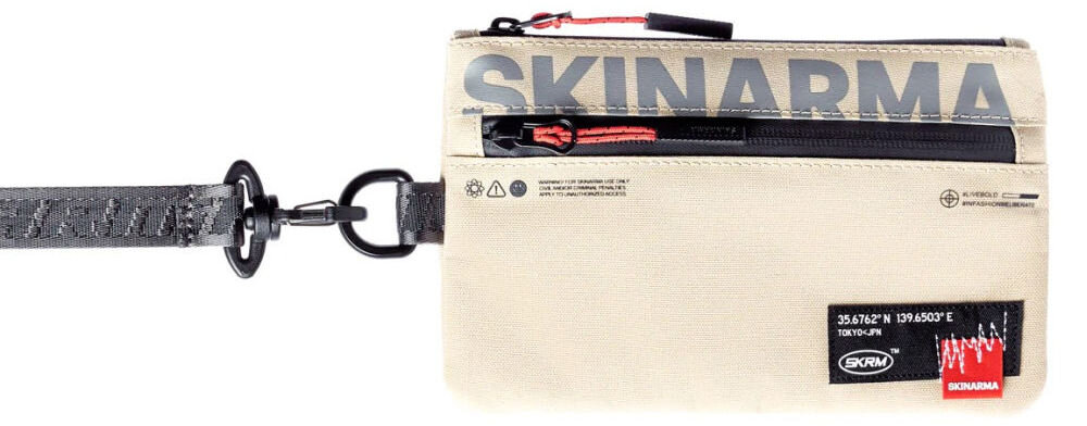 Torebka na telefon SKINARMA Fardel Kość słoniowa prezentacja torebki na białym tle połączenie stylu i technologii singapurska marka