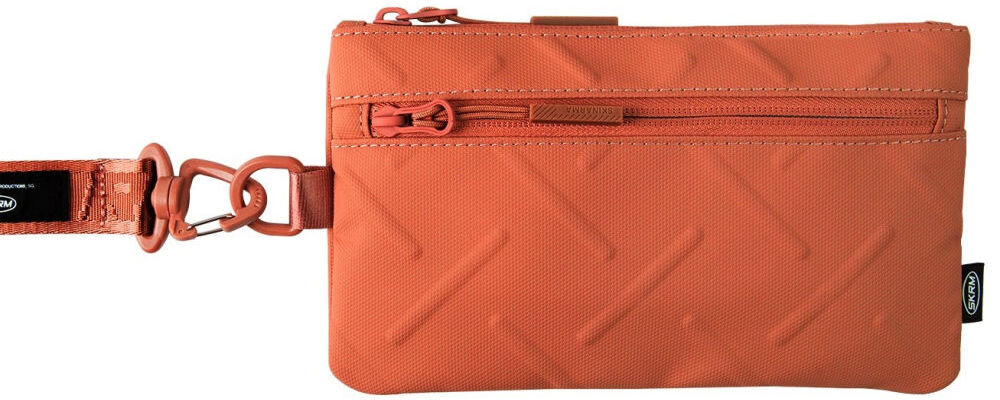 Torebka na telefon SKINARMA Juno Pomarańczowy prezentacja torebki na białym tle wodoodporny nylon tłoczona faktura zgrabna konstrukcja praktyczne zastosowanie
