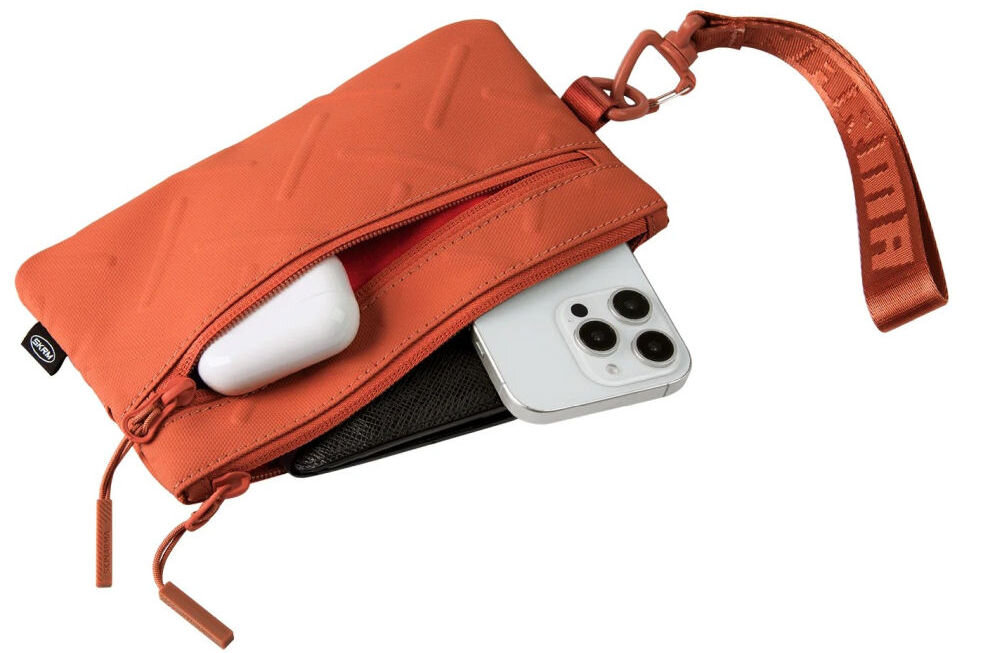 Torebka na telefon SKINARMA Juno Pomarańczowy prezentacja otwartej torebki na białym tle wygoda organizacja kieszenie kieszeń na suwak dwa paski w zestawie praktyczny karabińczyk