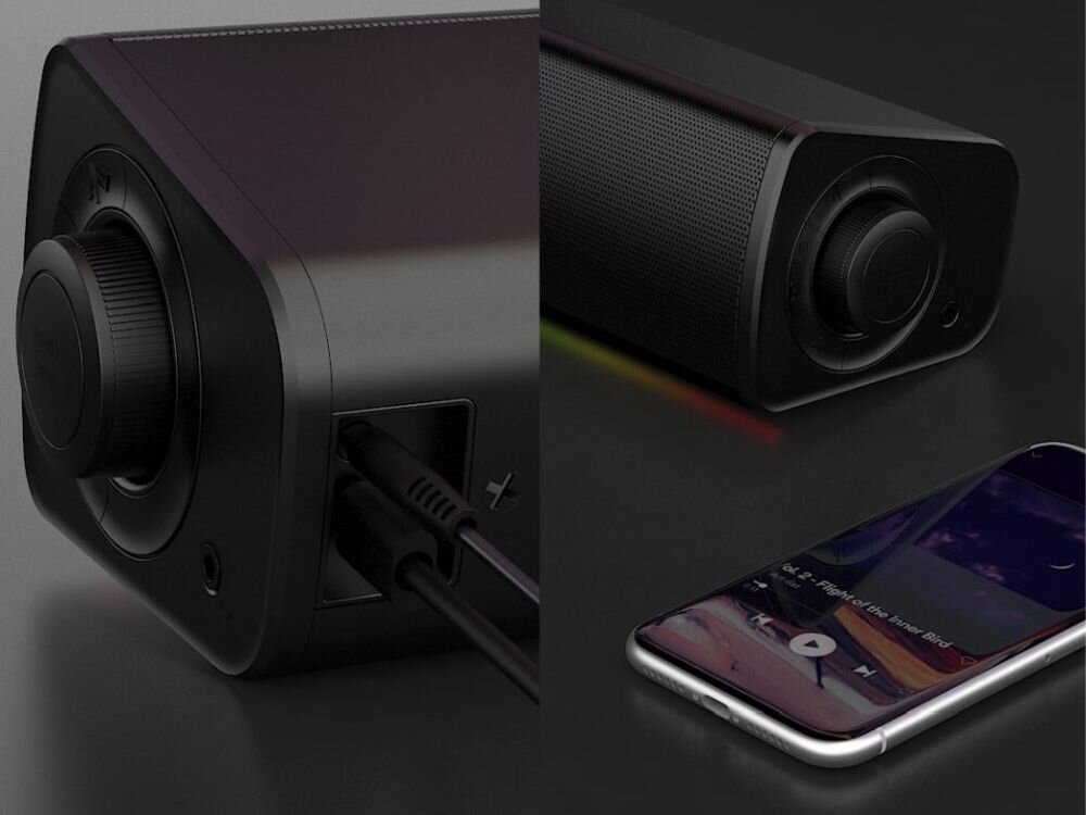Soundbar komputerowy CREATIVE GS3 2.0 zasilanie przez USB-C wejście AUX-in kompatybilność z PD, kadry soundbara, telefon leżący obok urządzenia