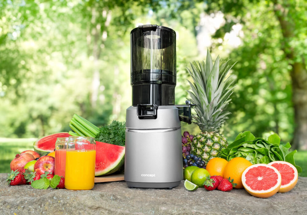 Wyciskarka wolnoobrotowa CONCEPT Juicy LO7120 Czarno-grafitowy obok owoców i warzyw na blacie nakładka anti drop czysty blat łatwe srzątanie bez przerywania wyciskania