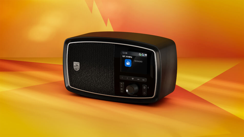 Radio PHILIPS TAV2000FB/00 klasyczny wygląd, pokrętło, 2,5-calowy przetwornik, radio po skosie na pomarańczowym tle