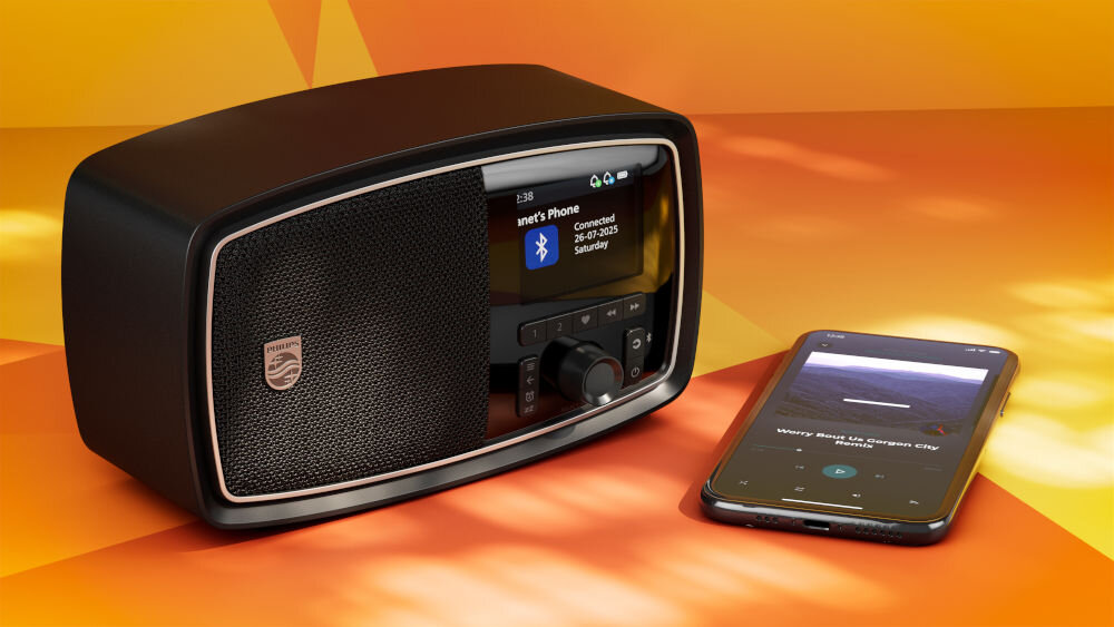 Radio PHILIPS TAV2000DB/00 Bluetooth 5.4, stabilne połączenie, przesyłanie audio, radio po skosie oraz smartfonem na pomarańczowym tle