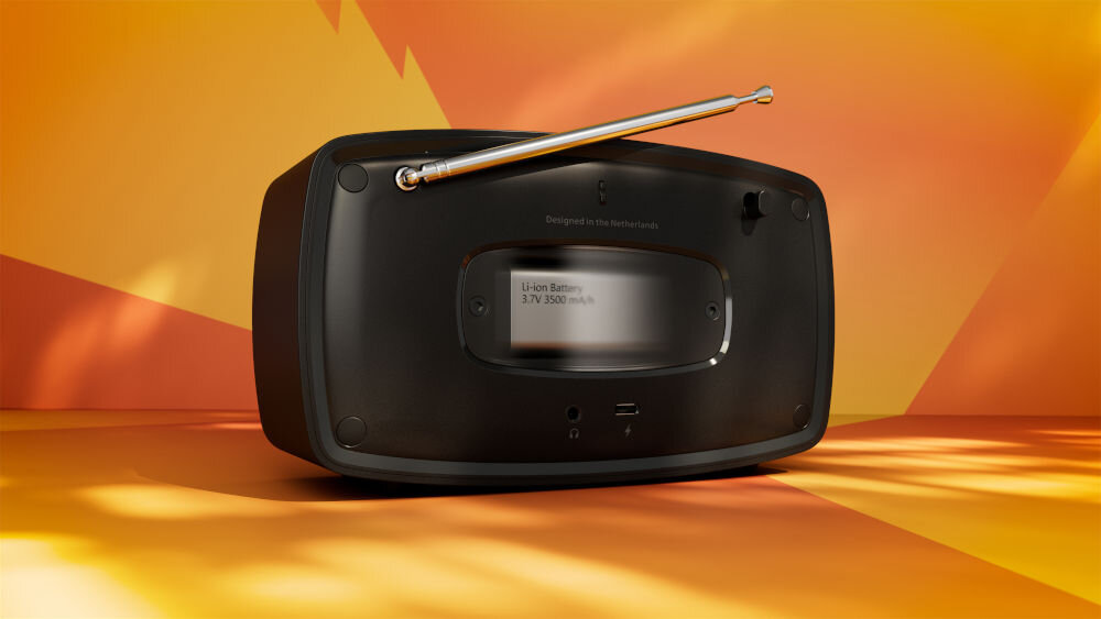 Radio PHILIPS TAV2000DB/00 bateria litowo-jonowa, USB-C, 15 godzin odtwarzania, radio od tyłu na pomarańczowym tle