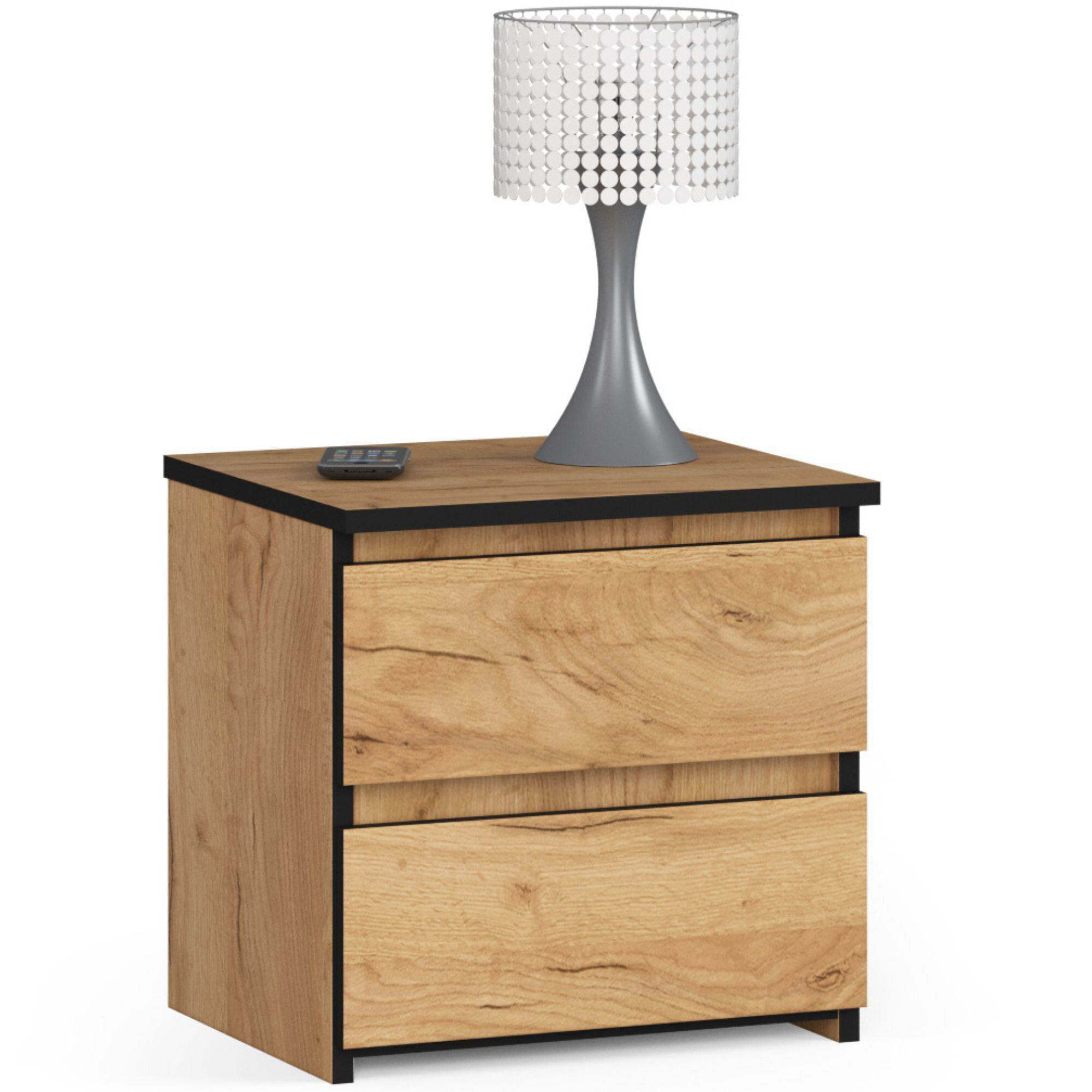 Szafka nocna z dwoma szufladami w kolorze dąb craft, na której stoi lampa z metalową podstawą i białym kloszem z ozdobnymi elementami. Obok lampy leży małe urządzenie elektroniczne.