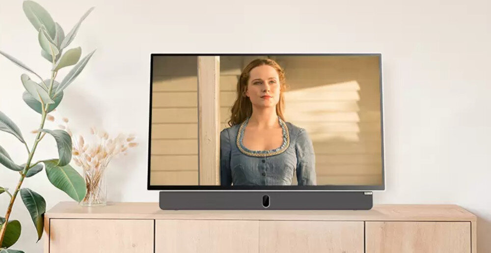 Telewizor METZ 24MPE7200Z ekran 24 cale Full HD obraz ostry kolory naturalne, telewizor stojący na komodzie w pomieszczeniu