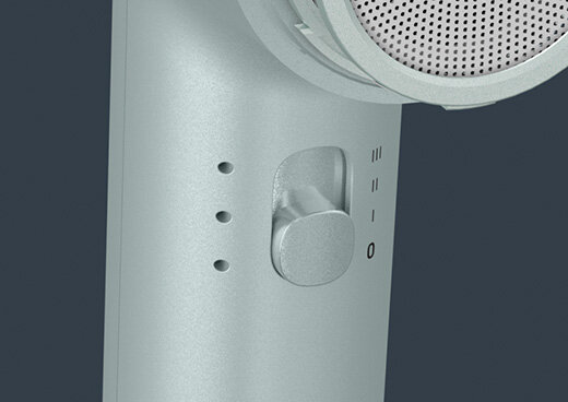 Zbliżenie na przycisk regulacji prędkości suszarki ROWENTA HY7120.