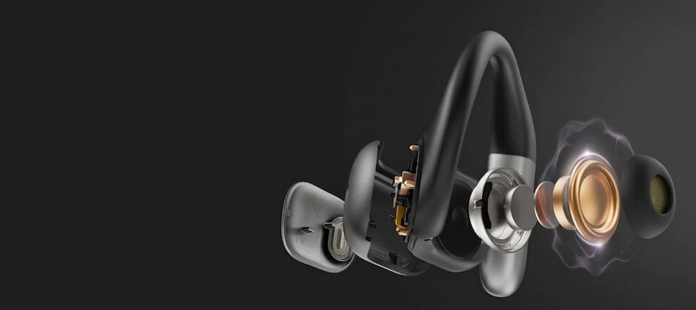 Obraz przedstawia szczegółowy widok konstrukcji słuchawki z widocznymi elementami wewnętrznymi, takimi jak przetwornik i obudowa. Tło jest jednolite i ciemne, co podkreśla detale słuchawki.