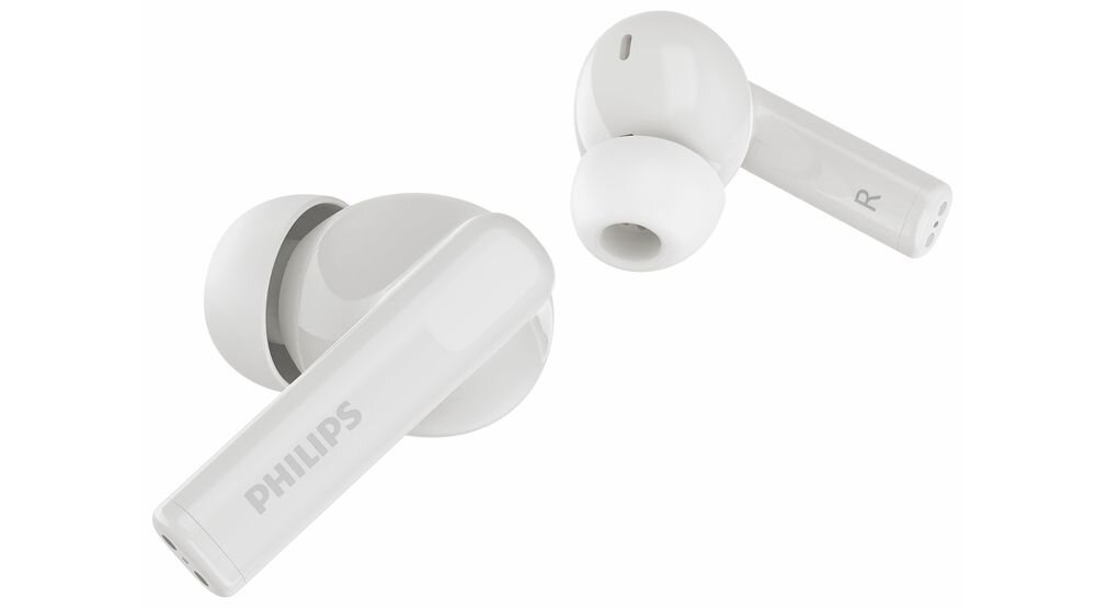 Na obrazie widoczne są białe słuchawki dokanałowe z logo PHILIPS na jednej z nich. Słuchawki mają silikonowe końcówki i oznaczenie \'R\' na jednej z nich.