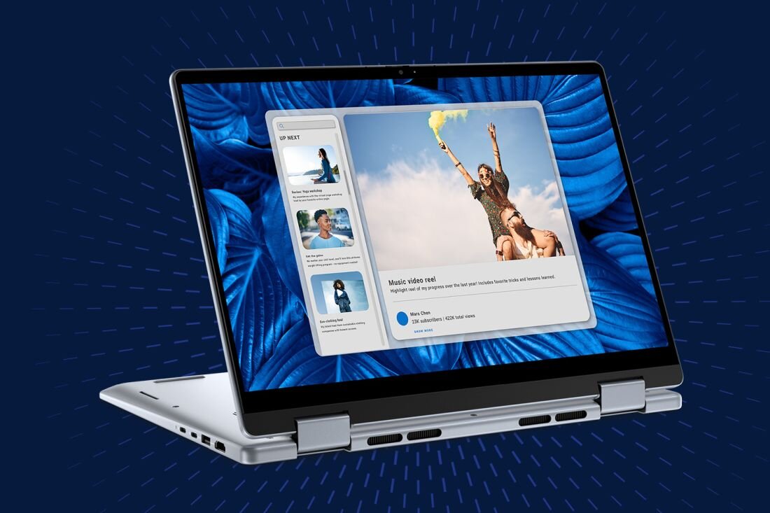 Laptop w trybie tabletu z wyświetlaczem pokazującym aplikację z filmem wideo i listą odtwarzania. Tło ekranu jest niebieskie z abstrakcyjnym wzorem.