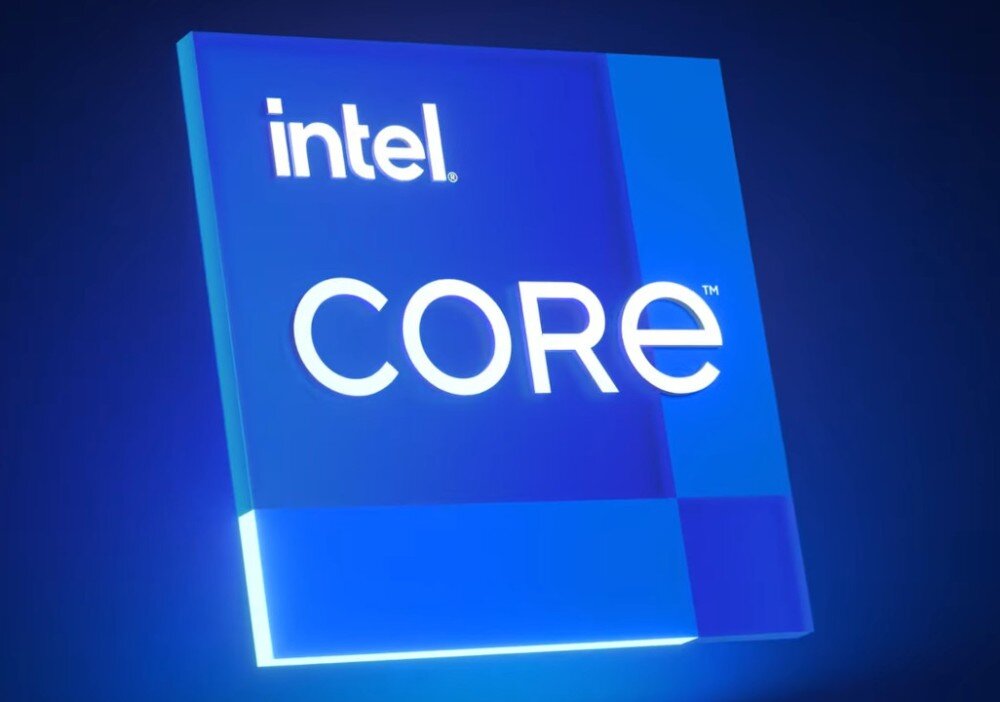 Komputer MSI Pro DP21 14M-889EU Trójwymiarowe logo procesora Intel Core w formie niebieskiej, błyszczącej plakietki na ciemnoniebieskim tle, procesor, podzespoły, pamięć