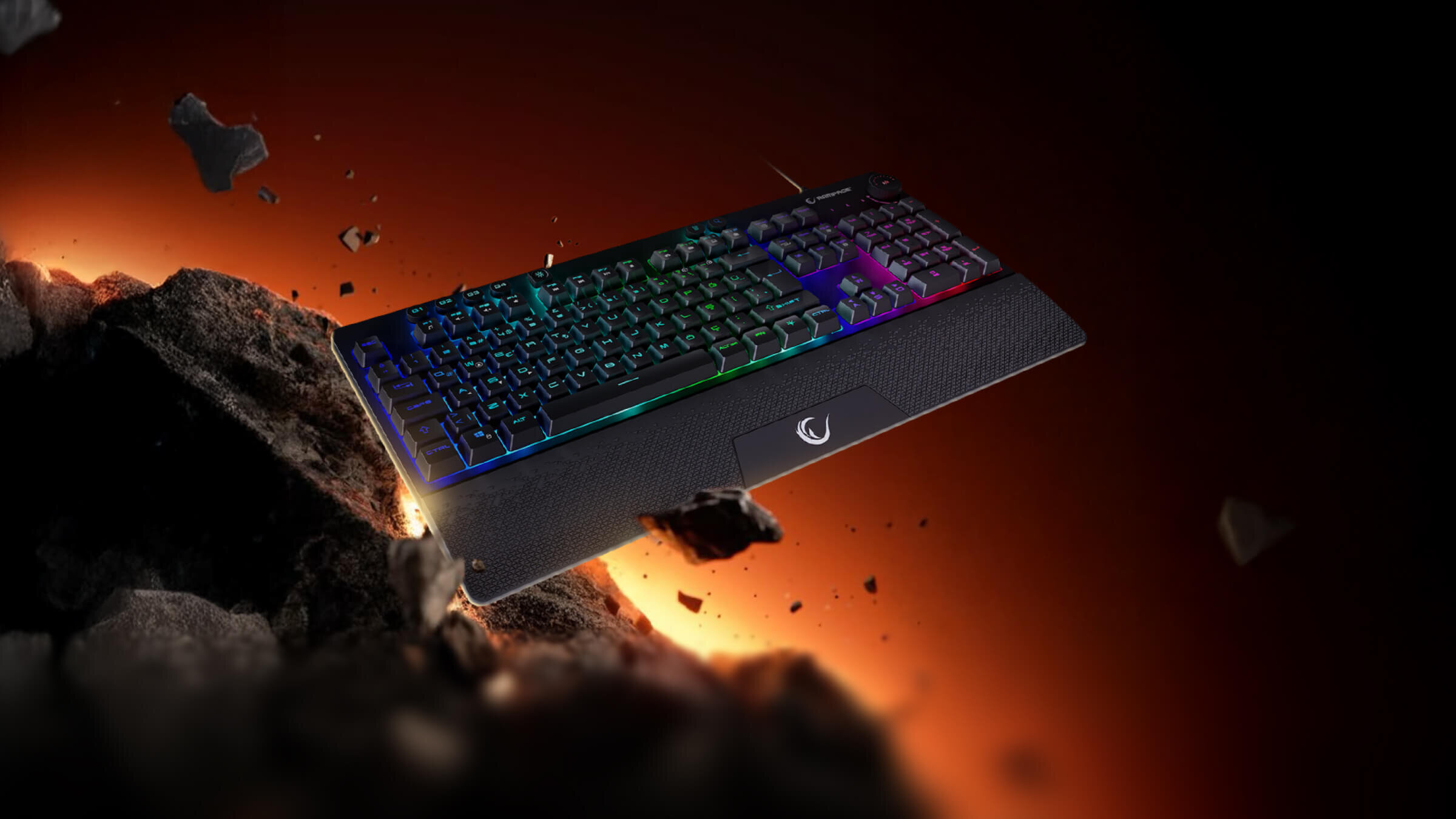 RAMPAGE KB-GX65 Simula RGB KB-GX65 Simula RGB Membranowa konstrukcja płynność pracy cichym działaniem - klawiatura na tle lifestyle, widać odłamki skały i światło