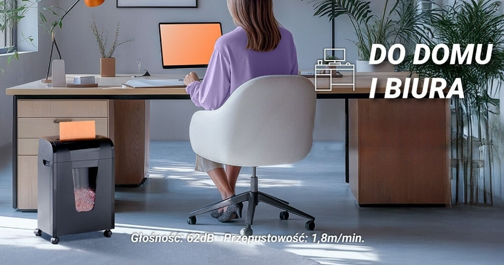 Niszczarka HAMA Prime M100 Shredder P-5, Ścinki, Automatyczny Start/Stop, Funkcja cofania kobieta siedząca przy biurku w jasnym pomieszczeniu obok biurka niszczarka z włożoną kartką głośność kółka transportowe wymiary panel sterowania komfortowa obsługa