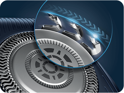 Obraz przedstawia zbliżenie na głowicę golarki z widocznymi ostrzami i detalami konstrukcji. W prawym górnym rogu znajduje się powiększenie pokazujące szczegóły ostrzy i wzór na powierzchni.