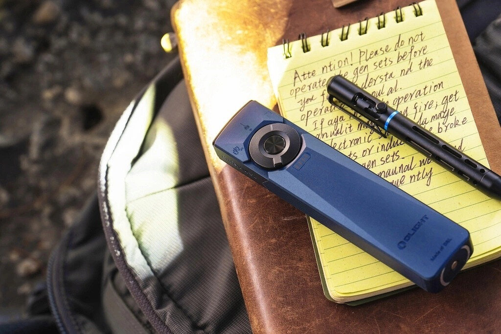 Latarka OLIGHT Arkfeld Ultra UV OL691688 Ciemnoniebieski, aluminium, odporność, IPX7, trwałość, Niebieska latarka na notatniku z długopisem