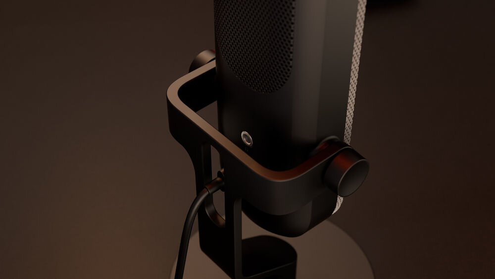 Mikrofon KRUX Pin KRXC018 Kardioidalny Czarny Zbliżenie na dolną część mikrofonu KRUX Pin, prezentujące gniazdo minijack 3,5 mm do podłączenia słuchawek, kabel oraz fragment mocowania podstawy gniazdo minijack 3,5 mm dostęp do odsłuchu w czasie rzeczywistym korygowanie tonu głosu głośności wychwyć potknięcia