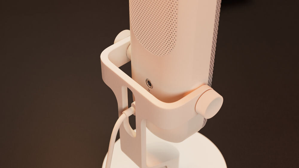 Mikrofon KRUX Pin KRXC019 Kardioidalny Biały Zbliżenie na dolną część mikrofonu KRUX Pin, prezentujące gniazdo minijack 3,5 mm do podłączenia słuchawek, kabel oraz fragment mocowania podstawy gniazdo minijack 3,5 mm dostęp do odsłuchu w czasie rzeczywistym korygowanie tonu głosu głośności wychwyć potknięcia