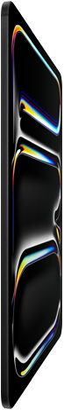 Widoczny od przodu iPad Pro w kolorze gwiezdnej czerni, smukła obudowa ze szkła i aluminium, urządzenie przechylone do tyłu, na wyświetlaczu kolorowy rysunek