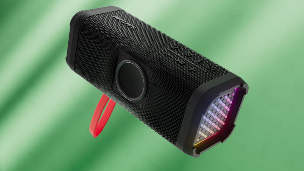 PHILIPS TAS2000B/00 głośnik mobilny Bass+, podwójne membrany, głębokie basy, wbudowany mikrofon, głośnik mobilny po skosie na zielonym tle