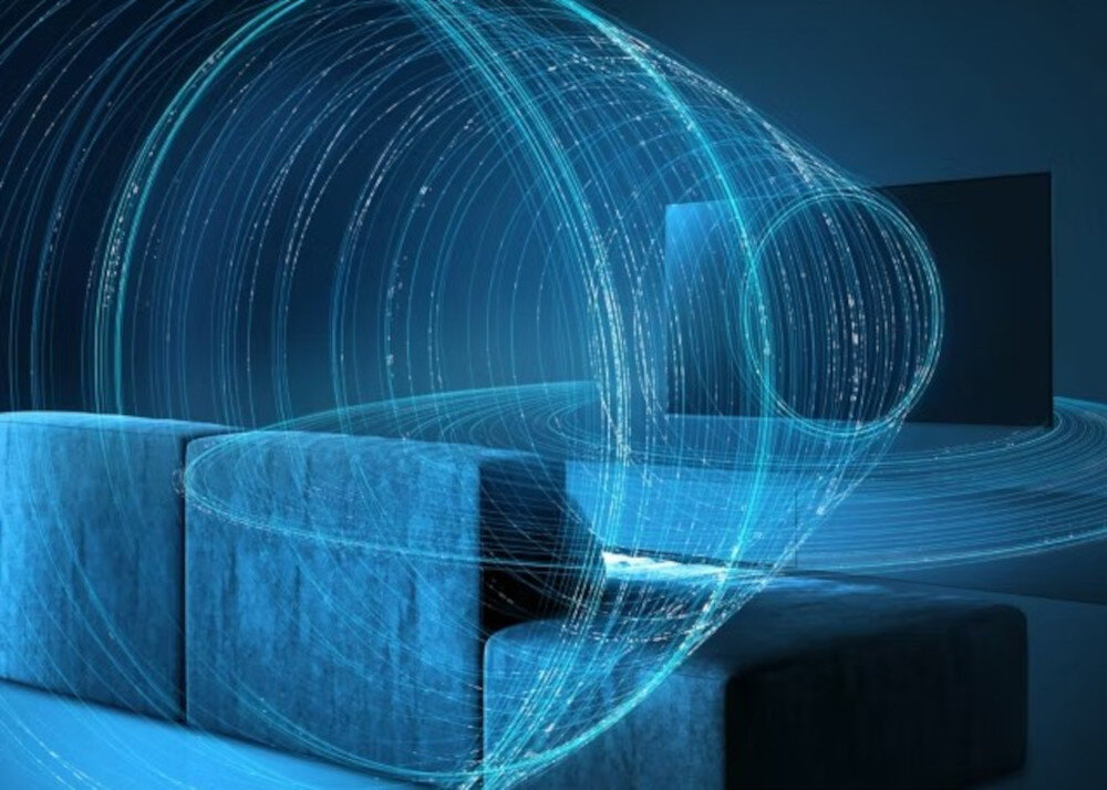 PANASONIC TV65W95BEG Dynamic Theater Surround precyzyjne niskie tony, telewizor stojący na komodzie z którego wydobywa się dźwięk