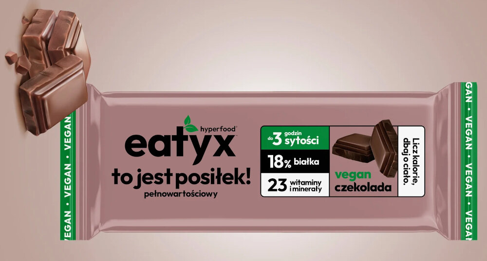 Baton proteinowy EATYX Hyperfood Czekoladowy (8 x 60 g) jasnobrązowe tło baton obok kostki czekolady komplet składników odżywczych jedna porcja 60 g dostarcza 238 kcal błonnik (12,1 g) roślinne białko (11,2 g) 13 witamin i 10 minerałów białko pochodzące z ciecierzycy oraz brązowego ryżu bezglutenowy błonnik roślinny bezglutenowe płatki owsiane prażone orzeszki ziemne migdały ciemna czekolada