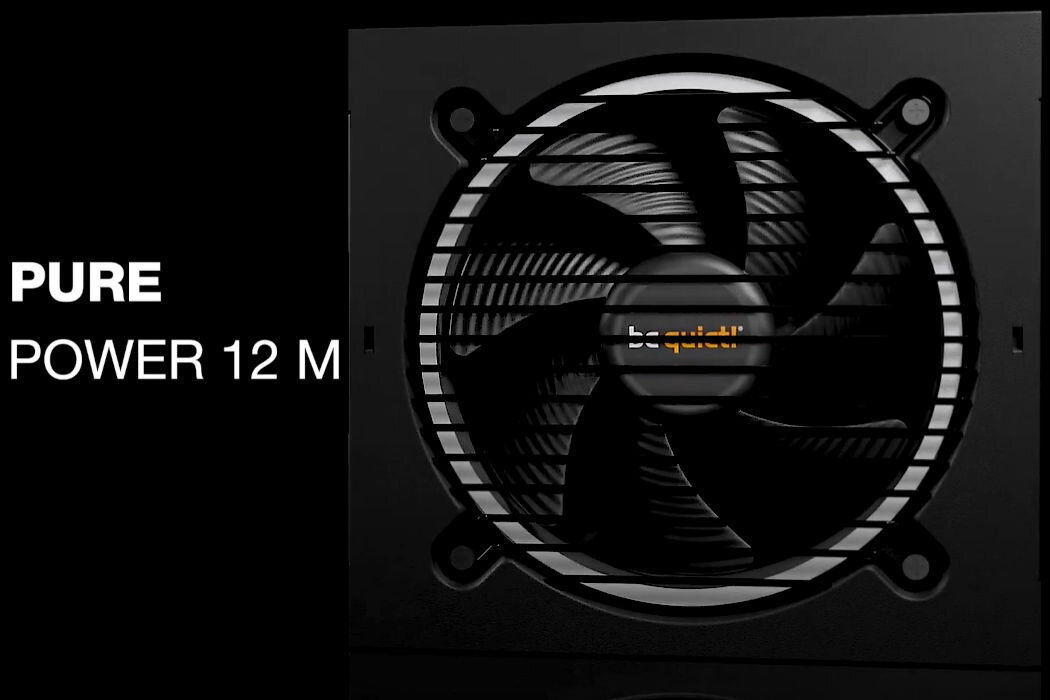 Obraz przedstawia zasilacz z widocznym wentylatorem i napisem \'be quiet!\' na środku. Po lewej stronie znajduje się tekst: \'PURE POWER 12 M\'.