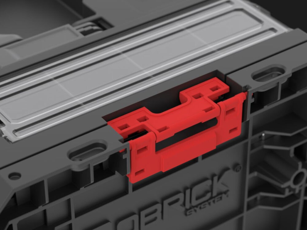 Skrzynia narzędziowa QBRICK PRO Drawer 3 Toolbox 2.0 Profi Basic, blokada, bezpieczeństwo, transport, etykieta, Czerwony zatrzask łączący elementy skrzyni.