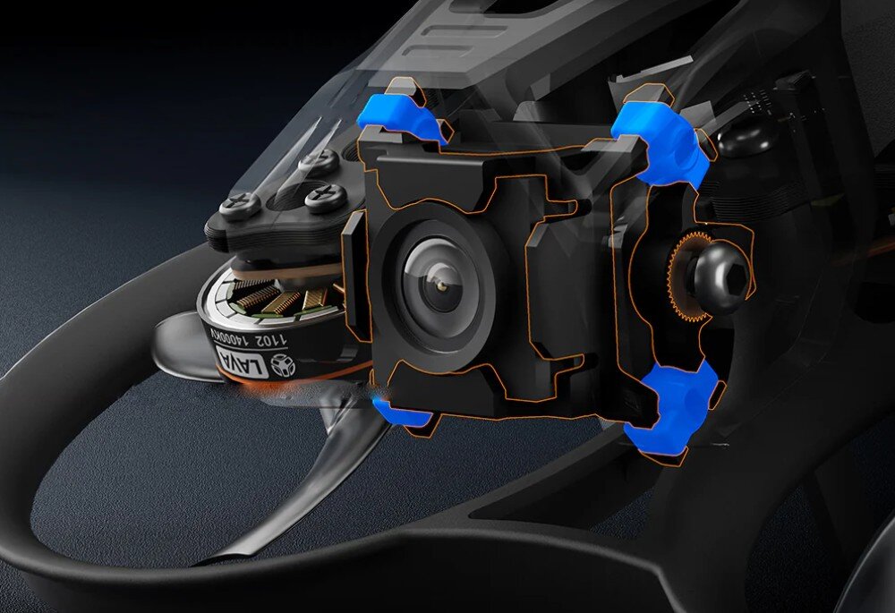 Dron BETAFPV Pavo Femto Zbliżenie na obiektyw kamery i niebieskie elementy amortyzujące drgania w konstrukcji drona