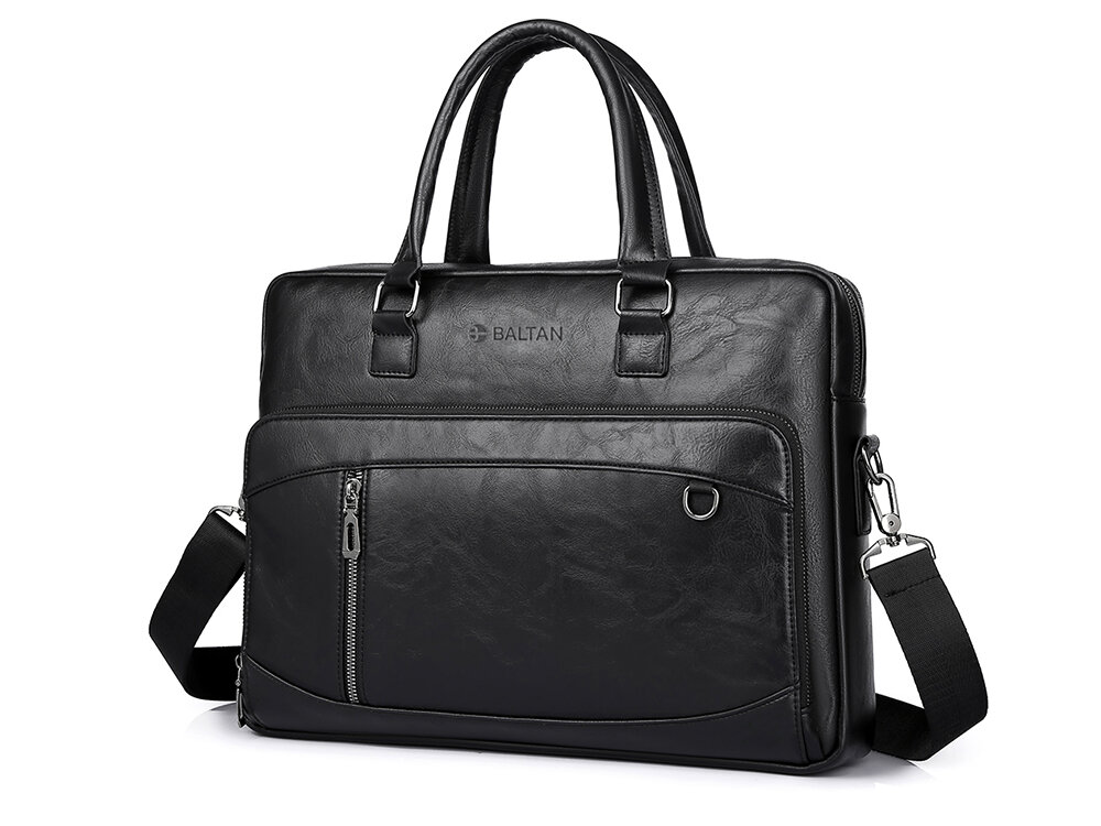 Torba na laptopa BALTAN Office 15.6 cali Czarna torba na laptopa marki Czarna torba na laptopa marki Baltan na białym tle, sfotografowana z przodu; widoczne są dwa uchwyty, pasek naramienny, przednia kieszeń na zamek oraz ozdobny metalowy element.