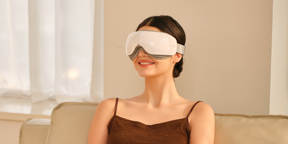 Masażer do oczu SKG ES500 Biały Pełny masaż okolicy oczu  masaż pneumatyczny, trzystopniowy kompres cieplny oraz relaksujące dźwięki Bluetooth z białym szumem komfort wygoda odpoczynek Pięć poduszeczek powietrznych w technologii Airwave Tech Miękka, przyjazna skórze powłoka  kilka minut masażu ulga