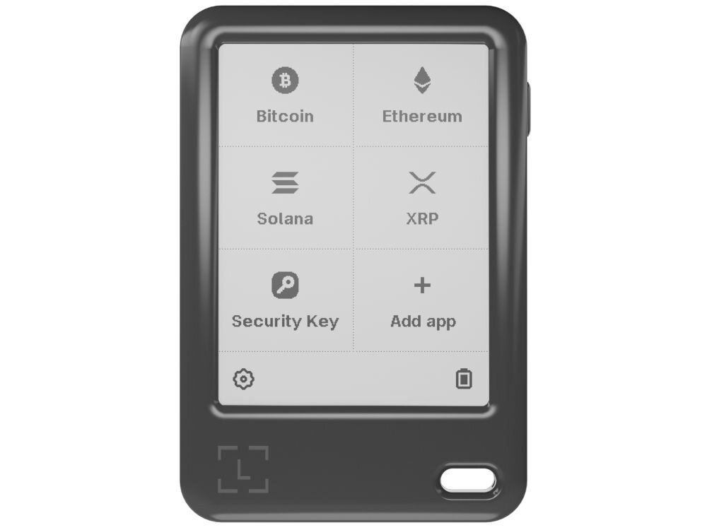 Portfel kryptowalut LEDGER Nano Gen5 Powiększone, proste ujęcie czarnego portfela sprzętowego Ledger Nano z włączonym ekranem. Ekran wyświetla siatkę ikon i nazw popularnych kryptowalut: Bitcoin, Ethereum, Solana, XRP, a także opcje Security Key i Add app. U dołu widoczne są ikony ustawień i kosza na śmieci.