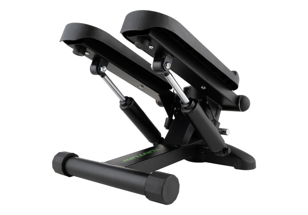 Czarny stepper z metalowymi elementami i amortyzatorami, przeznaczony do ćwiczeń fitness. Na podstawie widoczny jest napis \'TUNTURI\'.