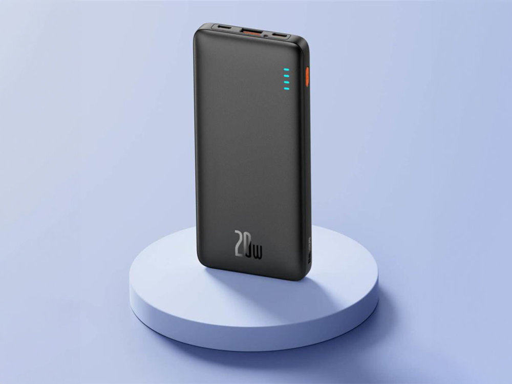 Powerbank BASEUS Airpow 30000 mAh Fast Charge 20 W w kolorze czarnym na okrągłej podstawie i tle w kolorze niebieskim