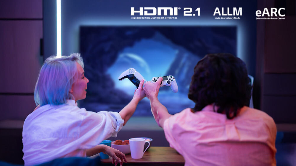 Telewizor JVC LT-43VG7500 HDMI 2.1 eARC ALLM dźwięk synchronizacja gry, osoby siedzące na kanapie trzymające kontrolery w ręku