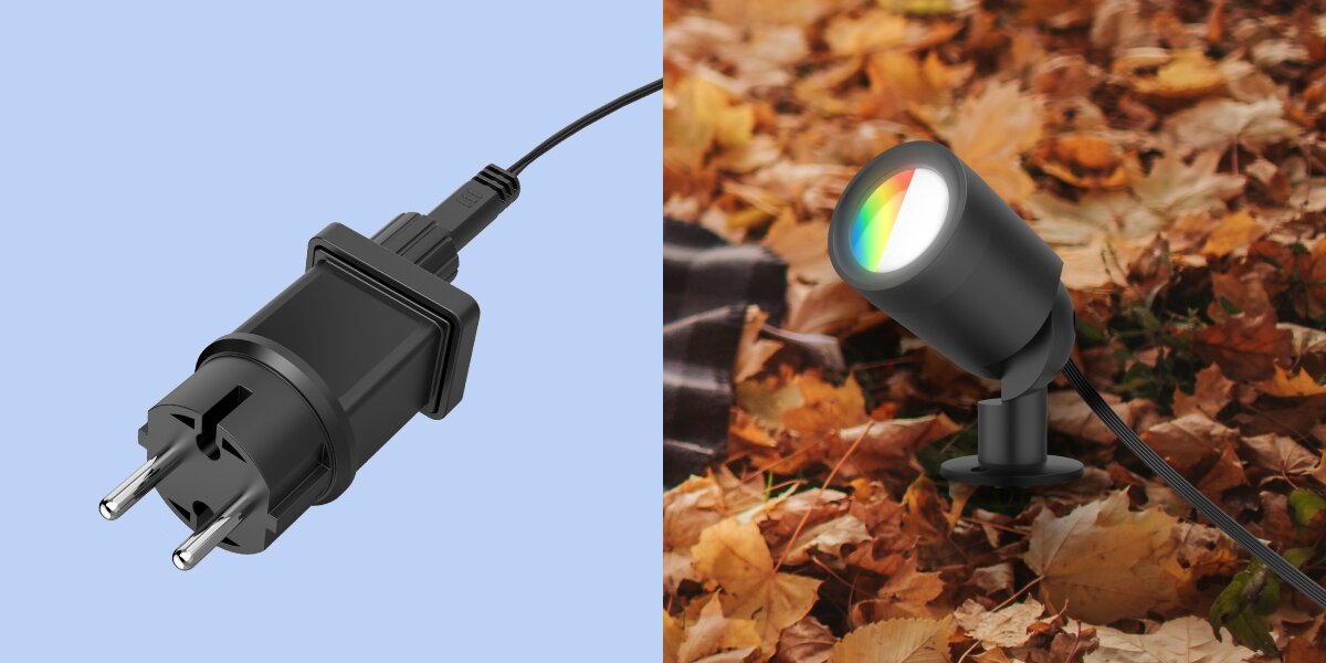 Lampa ogrodowa HAMA 00176679 Wi-fi, deszcz, śnieg, przewód, solidność, Wtyczka zasilająca oraz lampa ogrodowa ustawiona wśród jesiennych liści.