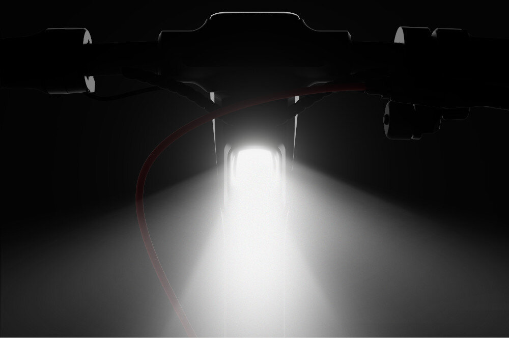 Hulajnoga elektryczna SEGWAY Ninebot F3 Pro D 70km 1200W Amortyzacja 10 cali Czarny ciemne tło zbliżenie na przednie światło przednie światło o mocy 6 W widoczność w ciemności światło włącza się i wyłącza automatycznie wbudowane kierunkowskazy tylne światło stopu bezpieczeństwo