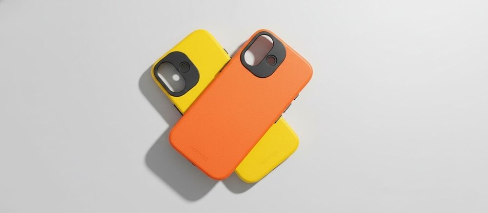 Dwa etui do telefonu w żywych kolorach ułożone na białym tle: pomarańczowe na wierzchu oraz żółte częściowo wystające spod niego.
