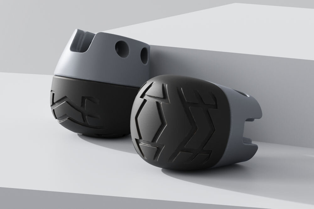 Nakładka na stopę UNITREE Go2 Foot Pad Dwa rendery szarych z czarnym nakładek na stopę robota Unitree z wyraźnym bieżnikiem, ułożone na białej platformie.