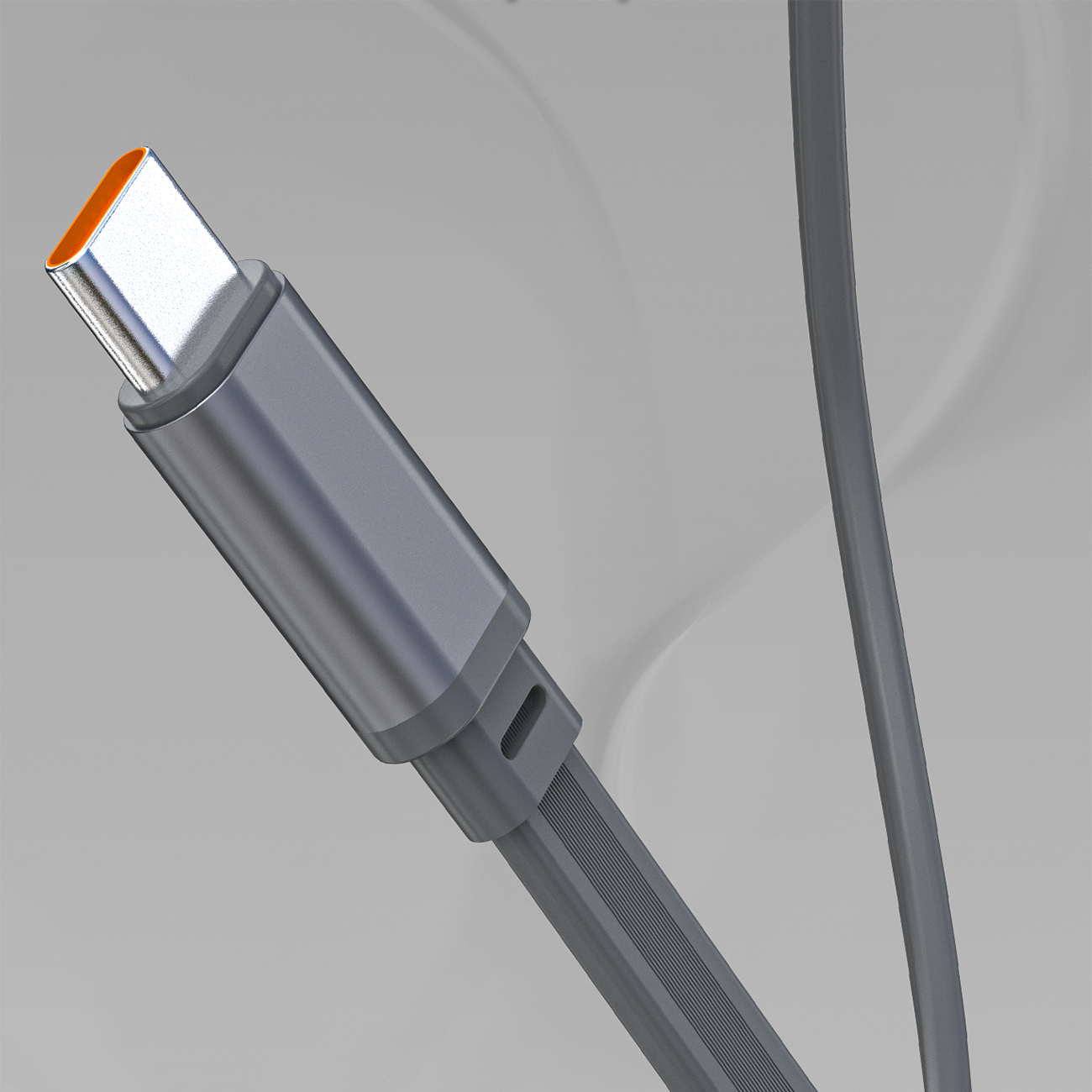 Obraz przedstawia szary kabel USB-C z pomarańczowym wnętrzem złącza, widoczny na tle o neutralnym kolorze.