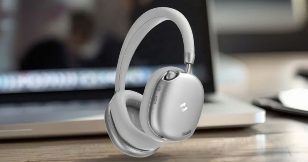 Słuchawki nauszne HAVIT Space S1 ANC Bluetooth 6.0 połączenie z dwoma urządzeniami, słuchawki nauszne po skosie na tle laptopa