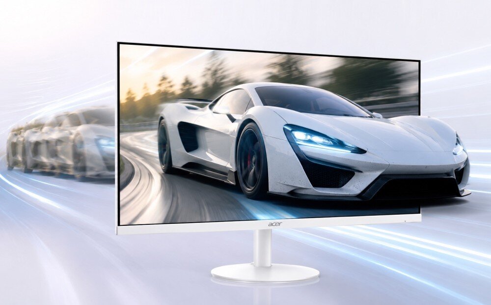 Monitor ACER SA243YP1WMIX Monitor prezentuje wyścigowe auto, które wyjeżdża poza krawędź ekranu. W tle widać efekt rozmytego ruchu