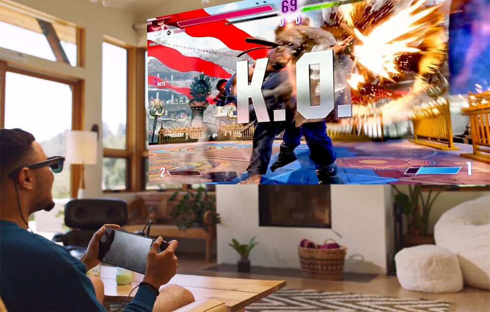 Okulary VITURE XR Luma Pro Czarny prezentacja okularów podczas użytkowania mężczyzna grający na konsoli w pokoju przed nim wirtualny ekran dobra czytelność obrazu niezależnie od warunków oświetleniowych jasność wierne odwzorowanie barw DeltaE poniżej 2 dokładne kolory