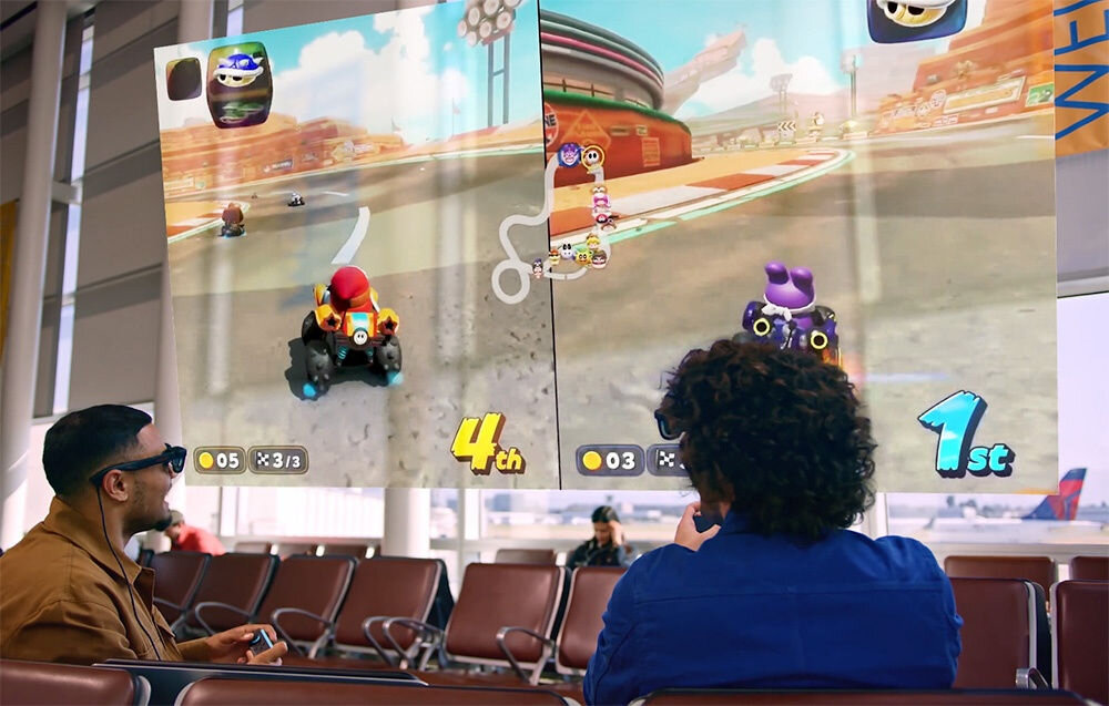 Okulary VITURE XR Luma Pro Czarny prezentacja okularów podczas użytkowania dwóch mężczyzn grających w grę wyścigową wirtualny ekran system audio Harman bogate detale dźwiękowe brzmienie współgra z obrazem