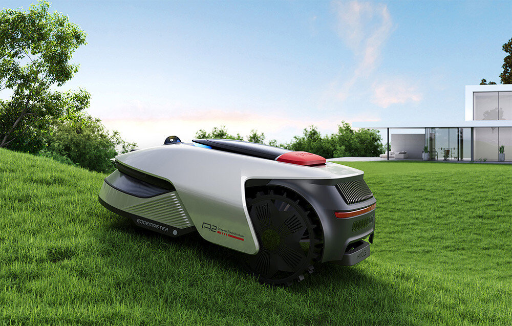 Robot koszący DREAME A2 robot na trawie w tle dom i niebo inteligentne koszenie zadbany trawnik zdale koszenie innowacyjne technologie intuicyjne rozwiązania