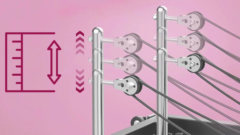 Reformer do pilatesu EXTRALINK Lifestyle PB1001 Czarny różowe tło zbliżenie na rolki do regulacji oporu czterostopniowa regulacja płynne dopasowanie poziomu trudności do indywidualnych potrzeb samoregulowany kąt ustawienia możesz stopniowo zwiększać obciążenie bezpieczny rozwój siły większa kontrola nad postępami treningowymi